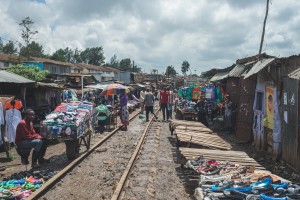 Sellers hawking their wares alongside active train tracks (Photo: Adam Nowek)