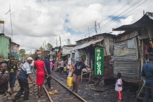 A train track runs along a major pedestrian thoroughfare in Kibera (Photo: Adam Nowek)
