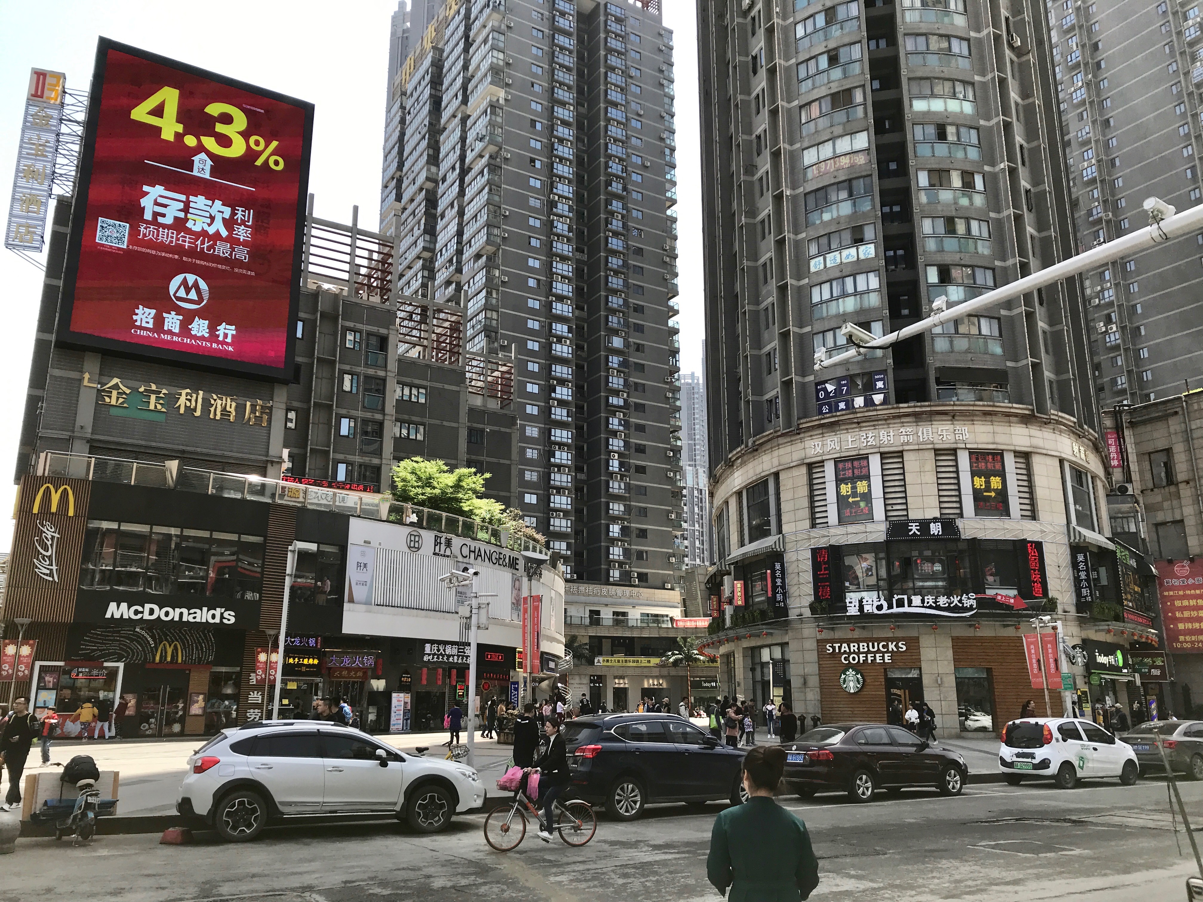 New apartments and shops near Zhongshan Avenue, featuring global chains like McDonald’s and Starbucks (Photo: Carl Hooks)